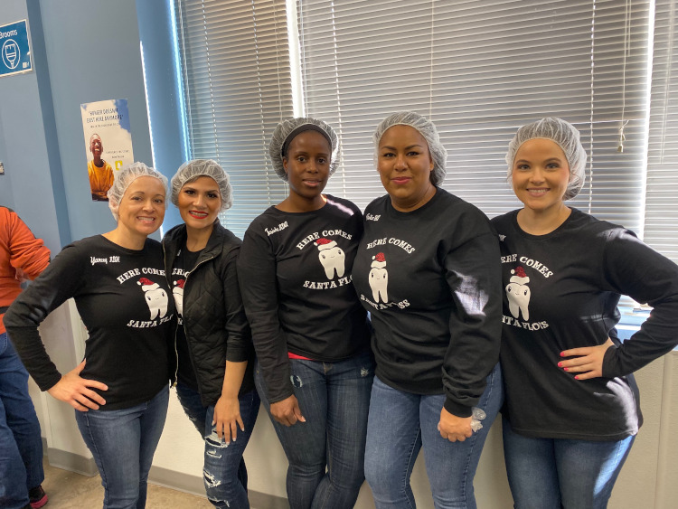 The Carrollton Dentist team volunteers with Feed My Starving Children